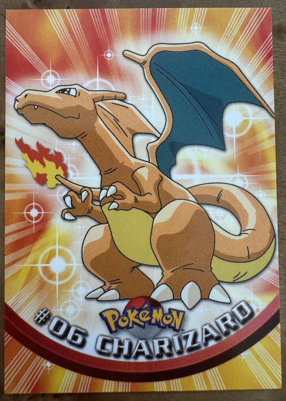 Original photo of a Charizard collectible card